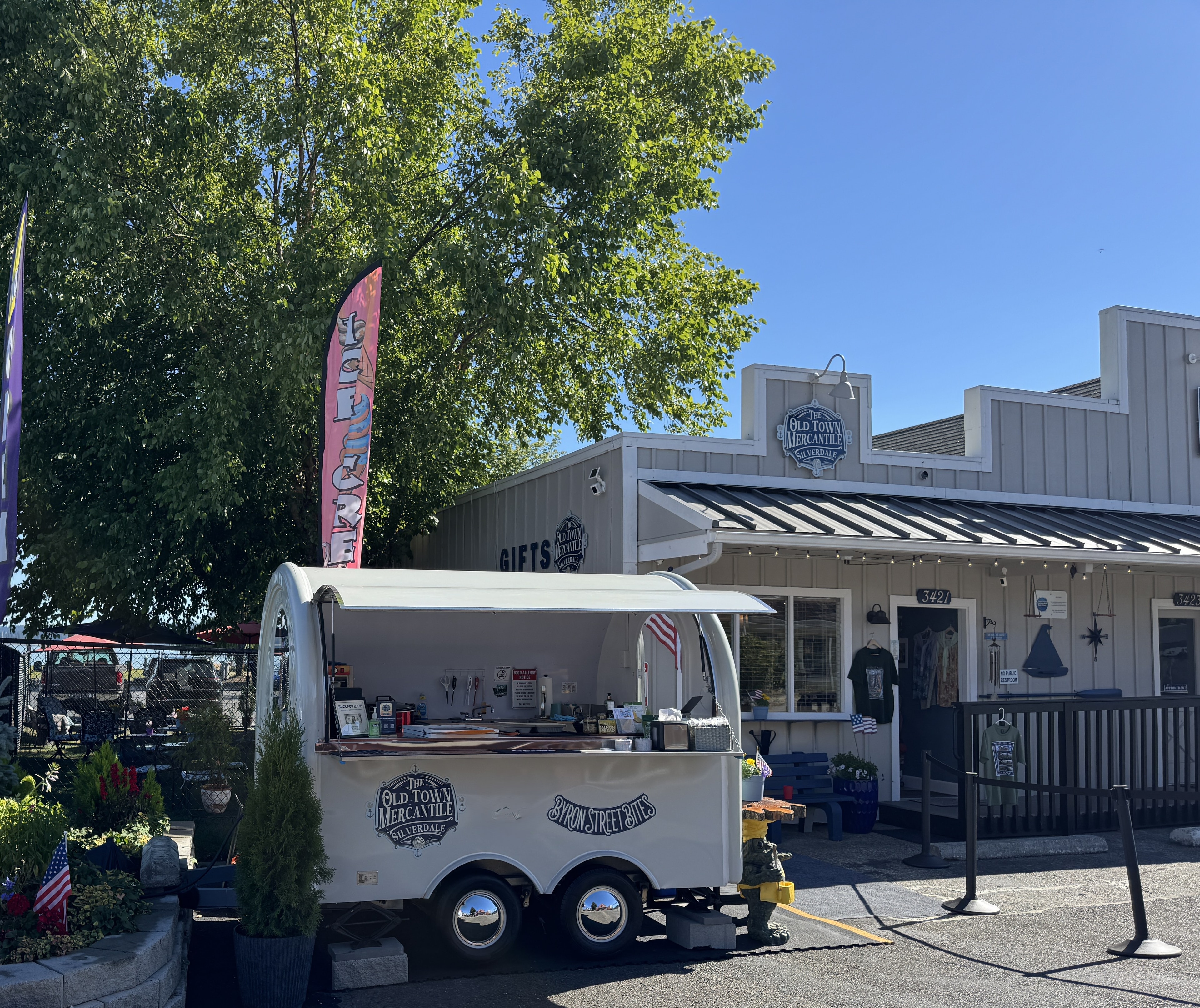 Byron Street Bites trailer at Old Town Mercantile with its two logo magnets visible