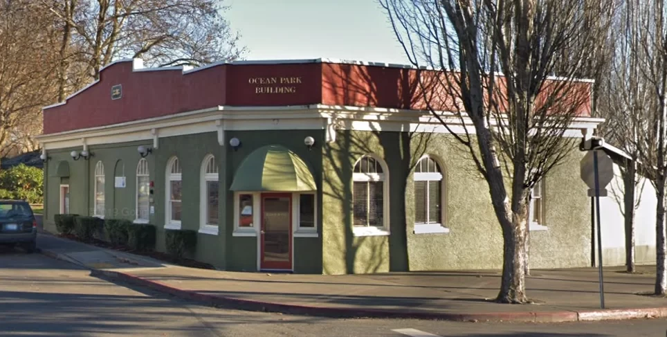 The Silverdale Bank building in a later era, showing the arched windows and Byron Street address